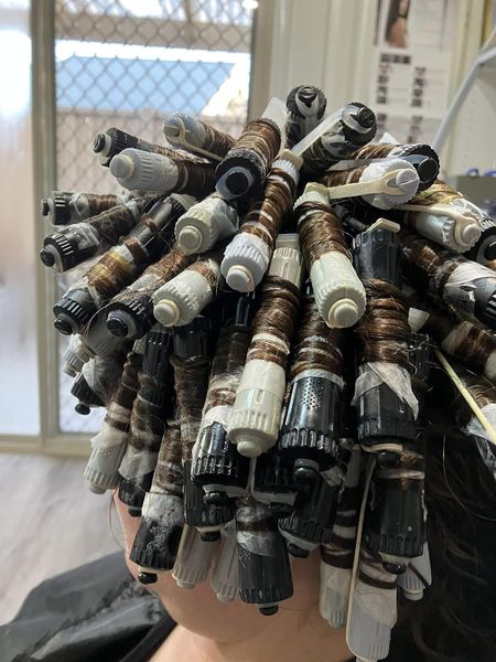 A full head of perm rods mid-way through a perm