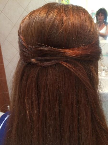 Auburn hair styled in a twisted half-up