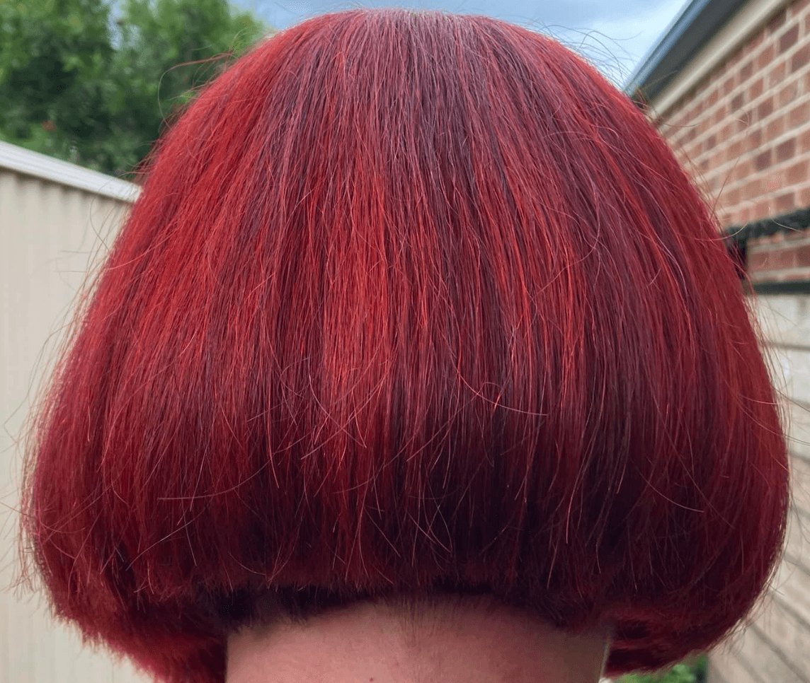 A vivid red bob, photographed from behind